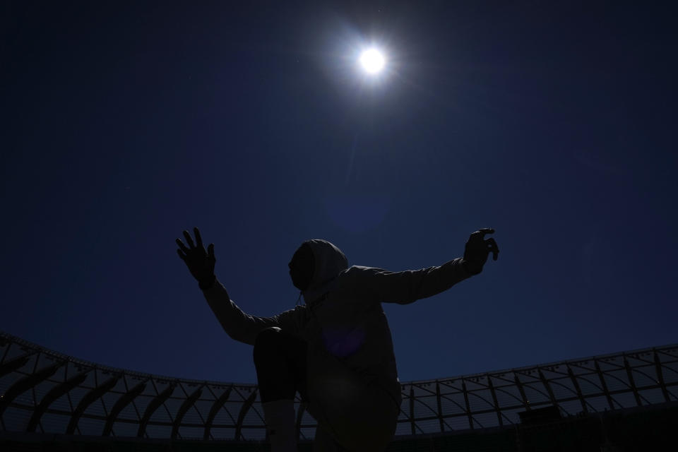 Eric Gregory stretches on the track at the U.S. Olympic Track and Field Trials, Wednesday, June 19, 2024, in Eugene, Oregon. The deaf sprinter from Gallaudet University earned the last spot into the 400-meter field at the U.S. Olympic Trials this week. (AP Photo/Charlie Neibergall)