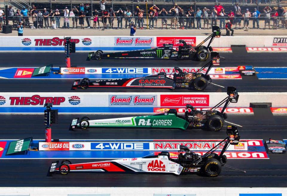 Apr 14, 2024; Las Vegas, NV, USA; NHRA top fuel drivers (from top) Brittany Force races alongside Steve Torrence, Josh Hart and Doug Kalitta during the 4 Wide Nationals at The Strip at Las Vegas Motor Speedway.