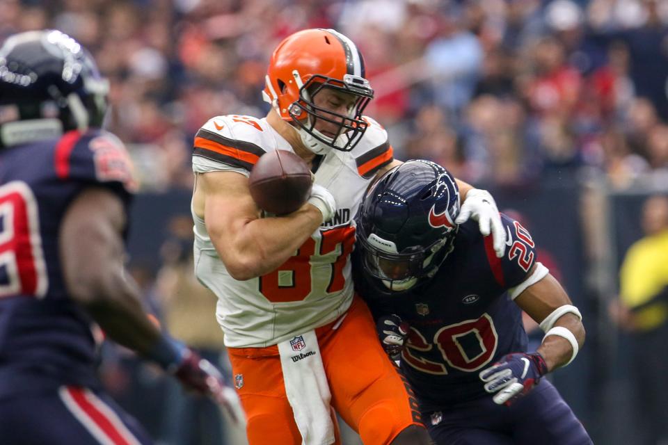 Dec 2, 2018; Houston, TX, USA; Cleveland Browns tight end Seth DeValve (87) loses the football after being hit by Houston Texans strong safety Justin Reid (20) during the second quarter at NRG Stadium.