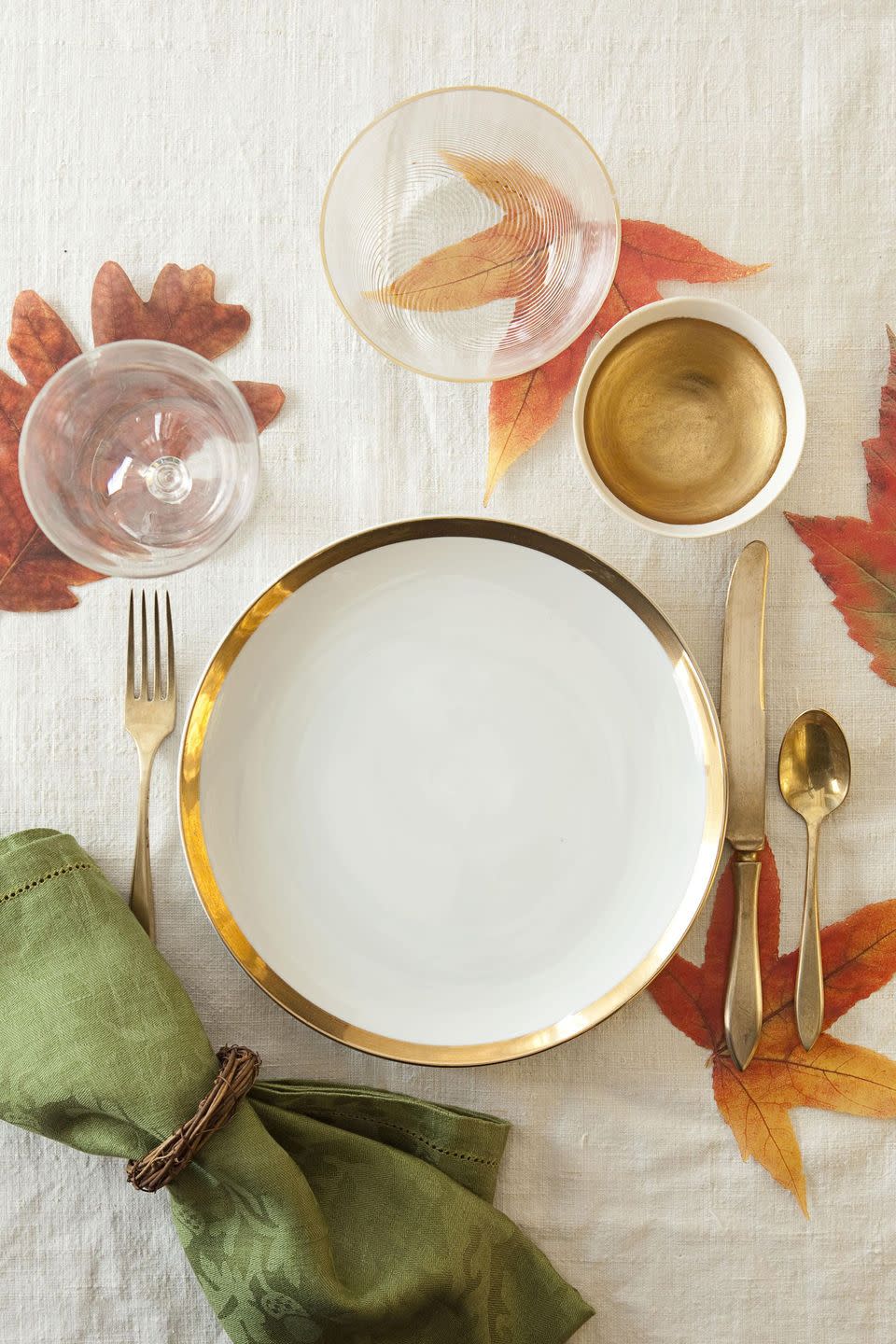 <p>Grab some foliage from the backyard — or grab reusable parchment leaves — and sprinkle them all around the table for a festive touch.</p><p><a class="link " href="https://www.amazon.com/Harvest-Imports-Pack-Parchment-Leaves/dp/B08CHLXXLF?tag=syn-yahoo-20&ascsubtag=%5Bartid%7C10070.g.23289609%5Bsrc%7Cyahoo-us" rel="nofollow noopener" target="_blank" data-ylk="slk:SHOP PARCHMENT LEAVES;elm:context_link;itc:0;sec:content-canvas">SHOP PARCHMENT LEAVES </a></p>