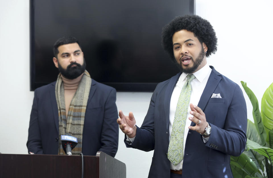 Quentin Savwoir, right, president of the Las Vegas branch of the NAACP, responds to a question as Athar Haseebullah, executive director of the ACLU of Nevada, listens at left, during a news conference at the ACLU of Nevada offices, Friday, Jan. 19, 2024, in Las Vegas. The news conference addressed questions relating to the release of Clark County School District Police body-worn camera footage depicting a CCSD police officer tackling and kneeling on a Black teen outside a Las Vegas high school last year. (Steve Marcus/Las Vegas Sun via AP)