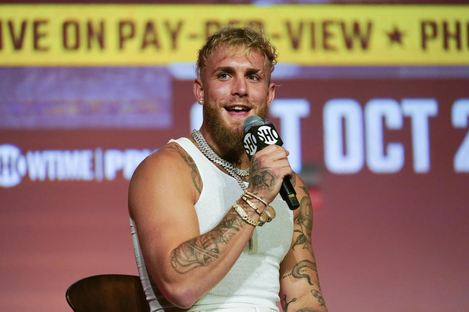 FILE - Jake Paul speaks during a news conference Monday, Sept. 12, 2022, in Los Angeles. Paul is the biggest name on the growing list of social media influencers improbably leveraging their fame into professional boxing careers. The YouTube star has become a bankable attraction on Showtime pay-per-view shows less than three years after he started training in earnest. He will fight Anderson Silva on Saturday, Oct. 29, 2022, in Glendale, Arizona. (AP Photo/Ashley Landis, File)
