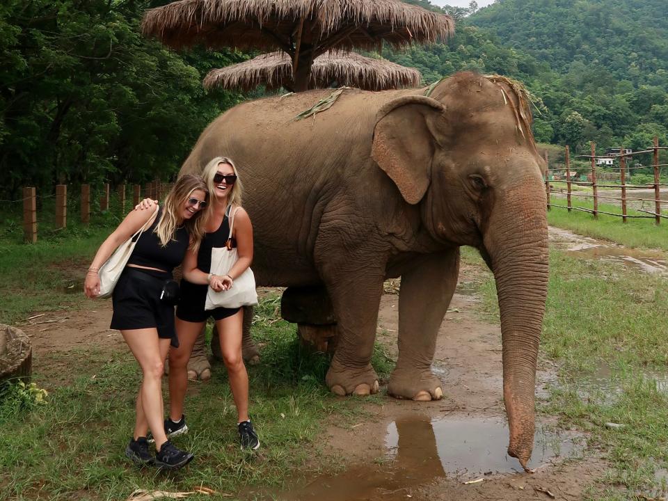 Christen Puckett and Jordan Carlyle with an elephant