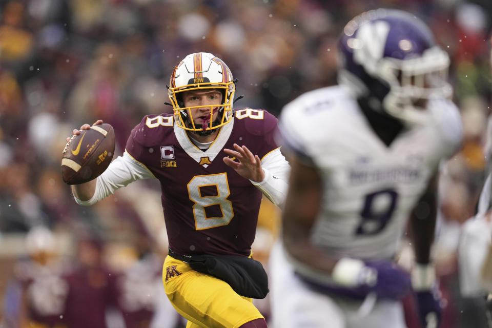 Minnesota quarterback Athan Kaliakmanis (8) looks to pass during the first half of an NCAA college football game against Northwestern, Saturday, Nov. 12, 2022, in Minneapolis. (AP Photo/Abbie Parr)