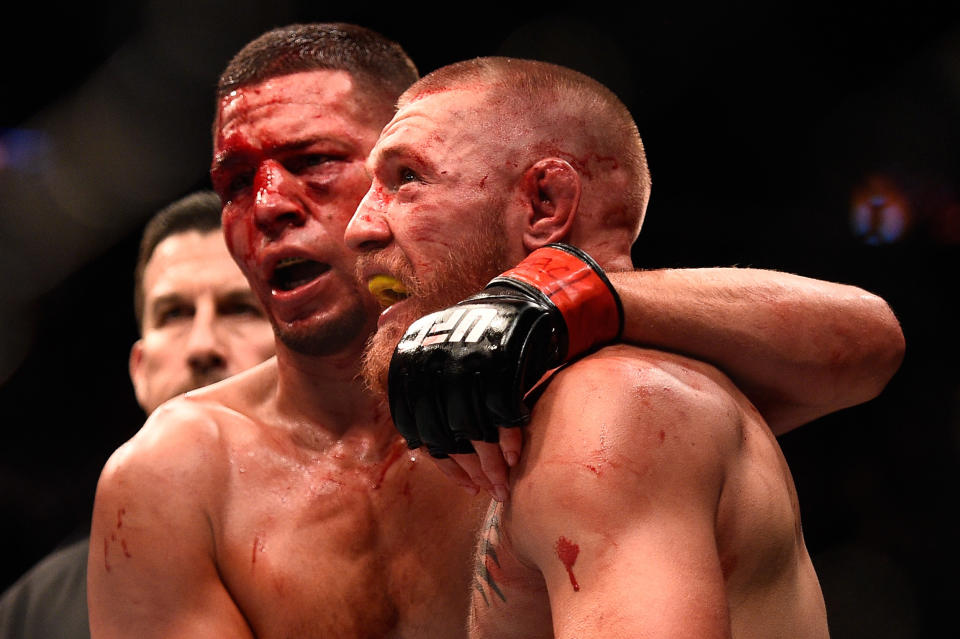 LAS VEGAS, NV - AUGUST 20:  (L-R) Nate Diaz and Conor McGregor of Ireland embrace after finishing five rounds in their welterweight bout during the UFC 202 event at T-Mobile Arena on August 20, 2016 in Las Vegas, Nevada. (Photo by Jeff Bottari/Zuffa LLC/Zuffa LLC via Getty Images)