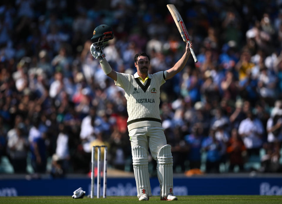 Travis Head celebrates his century.