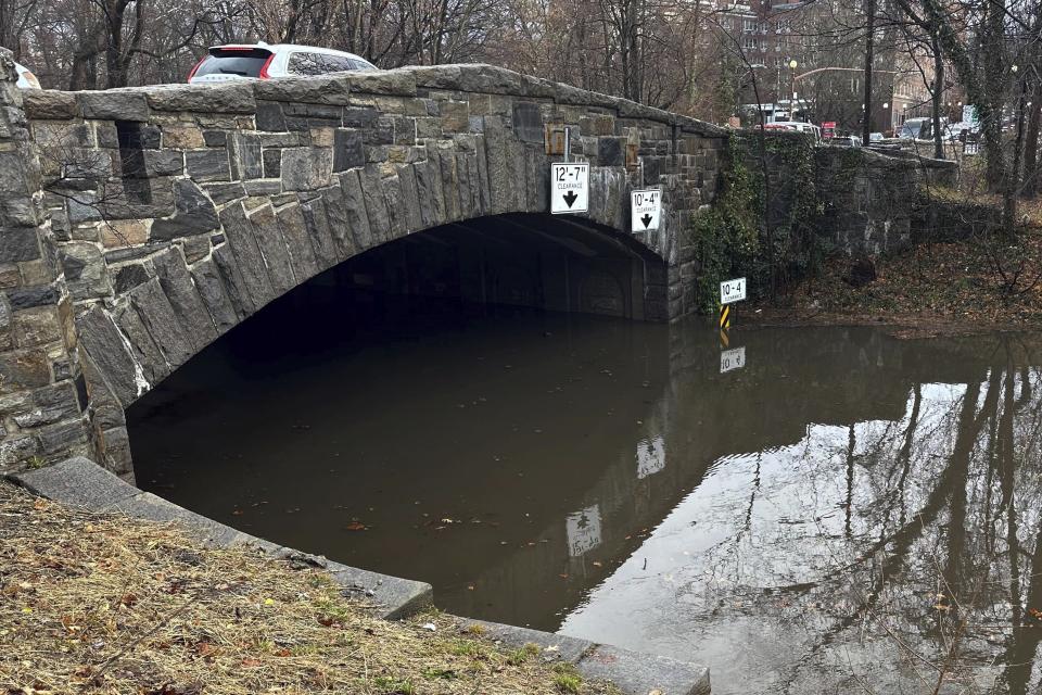 Cars traverse the storm flooded Bronx River Parkway, in Yonkers, NY, Monday, Dec. 18, 2023. Heavy rain and high winds swept through the Northeast on Monday for the second time in a week, spurring flood warnings, electricity outages, flight cancelations and school closings. (AP Photo/Luke Sheridan)