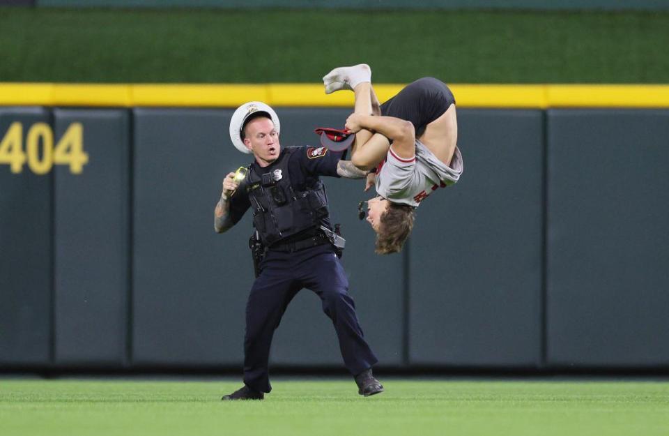 CINCINNATI, OHIO - JUNE 11:  An unidentified fan does a flip on the field before the ninth inning of the Cincinnati Reds against Cleveland Guardians at Great American Ball Park on June 11, 2024 in Cincinnati, Ohio. (Photo by Andy Lyons/Getty Images)