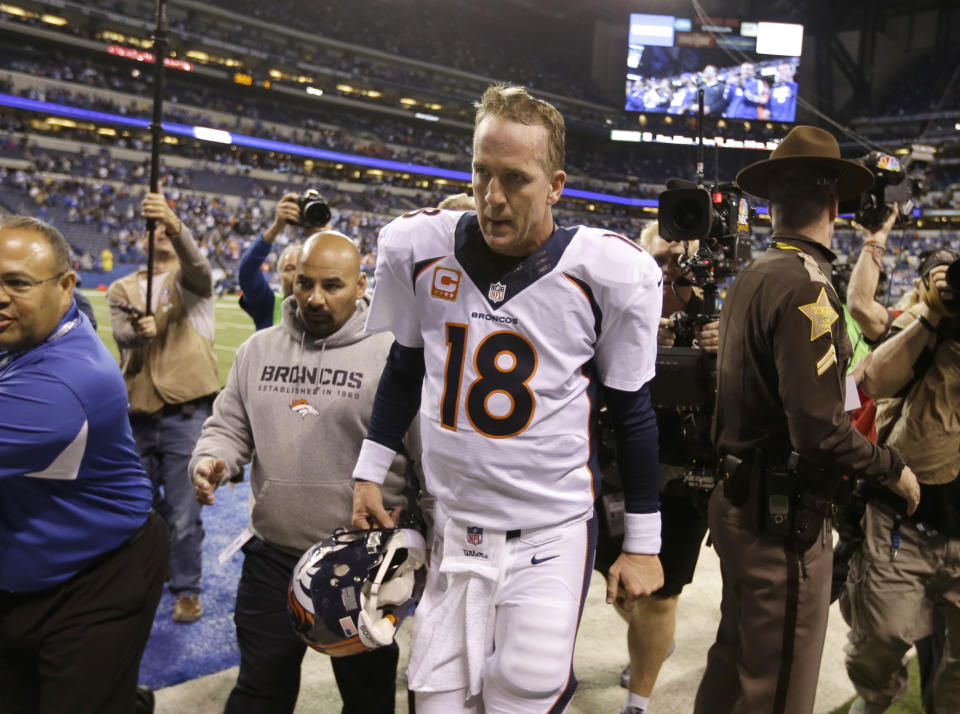 FILE - Denver Broncos quarterback Peyton Manning (18) walks off the field after an NFL football game against the Indianapolis Colts in Indianapolis, in this Sunday, Oct. 20, 2013, in Indianapolis. The Colts won 39-33. After five straight victories to open the season with his new team, the Broncos, Manning was on his way to his record fifth MVP award while setting all sorts of league passing marks. The matchup with the Colts in Indianapolis was ballyhooed like the second coming, but despite Manning's brilliance _ three touchdown passes, 386 yards in the air _ his replacement, Andrew Luck, got the win 39-33. “I am kind of relieved in some ways that this game is over,” he said at the end of a long night. (AP Photo/Michael Conroy, File)