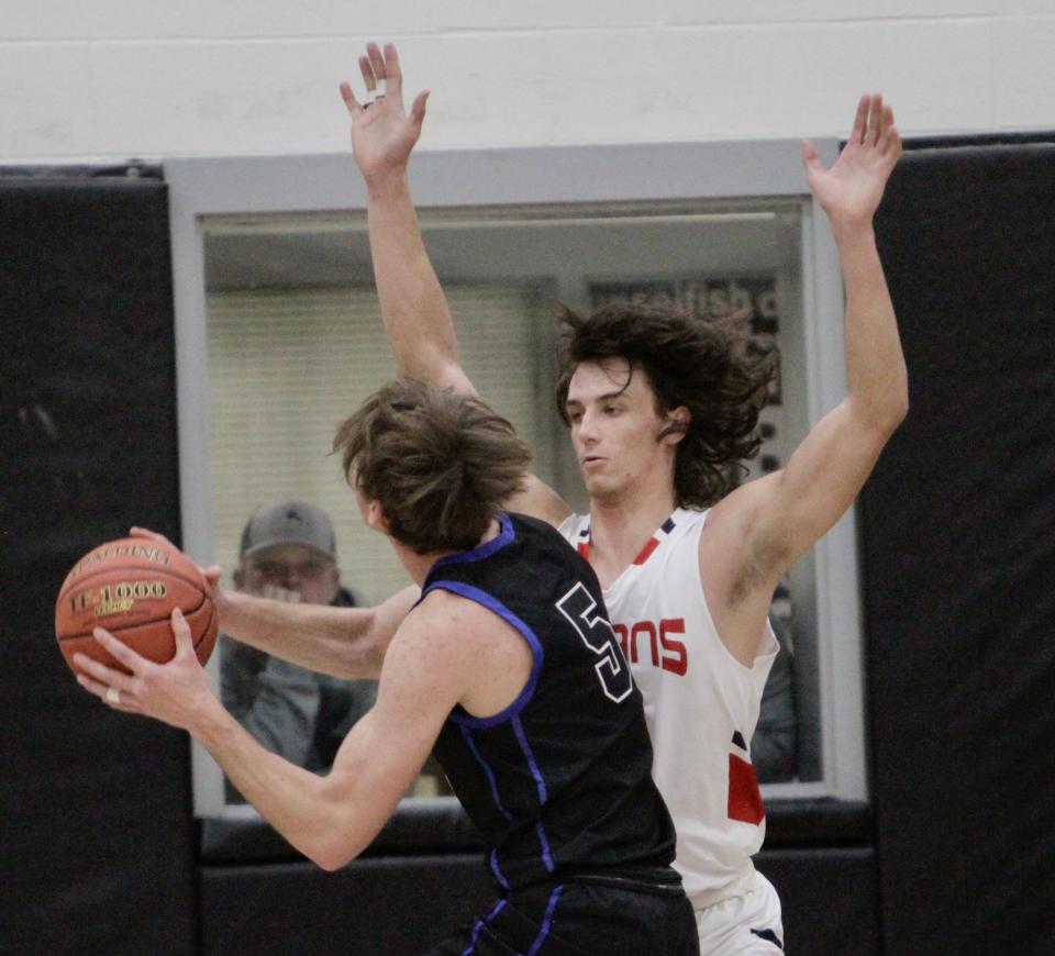 Jim Ned senior Ben Eshelman defends a shot from Peaster's Noah Drenth in an area playoff game on Thursday, Feb. 24, 2022.