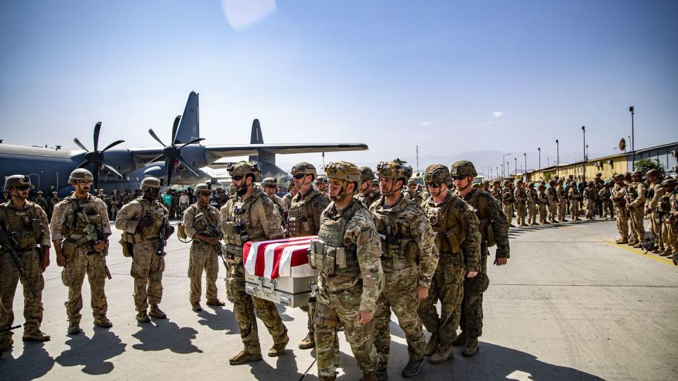 FILE - In this image provided by the U.S. Marine Corps, U.S. service members assigned to Joint Task Force-Crisis Response, are pallbearers on Friday, Aug. 27, 2021, for the service members killed in action during operations at Hamid Karzai International Airport in Kabul, Afghanistan, as transfer cases are placed onto a U.S. Air Force C17A Globemaster III for the flight back to the United States. (1st Lt. Mark Andries/U.S. Marine Corps via AP, File)