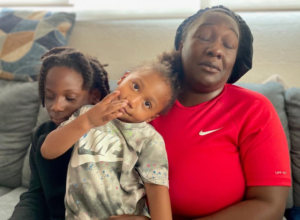 Anqunette Harvey says she is 'blessed,' as she holds 3-year-old Andre next to her son Andrew, 8. Andrew was rescued from a near drowning last weekend.