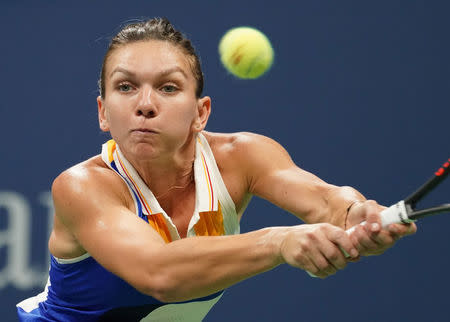 FILE PHOTO - Simona Halep of Romania hits to Maria Sharapova of Russia. Mandatory Credit: Robert Deutsch-USA TODAY Sports