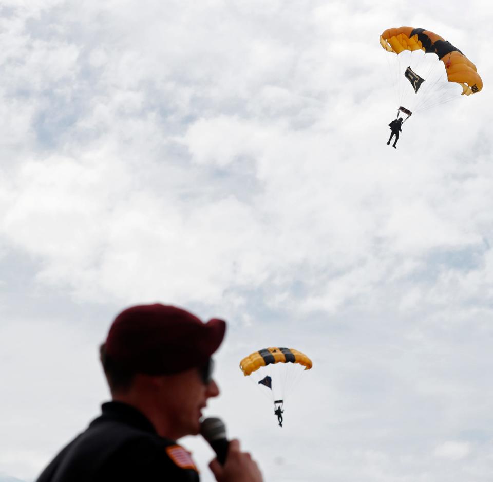 The Army Golden Knights perform skydiving tricks, Friday, April 14, 2023, at the Purdue University Aiport in West Lafayette, Ind. 