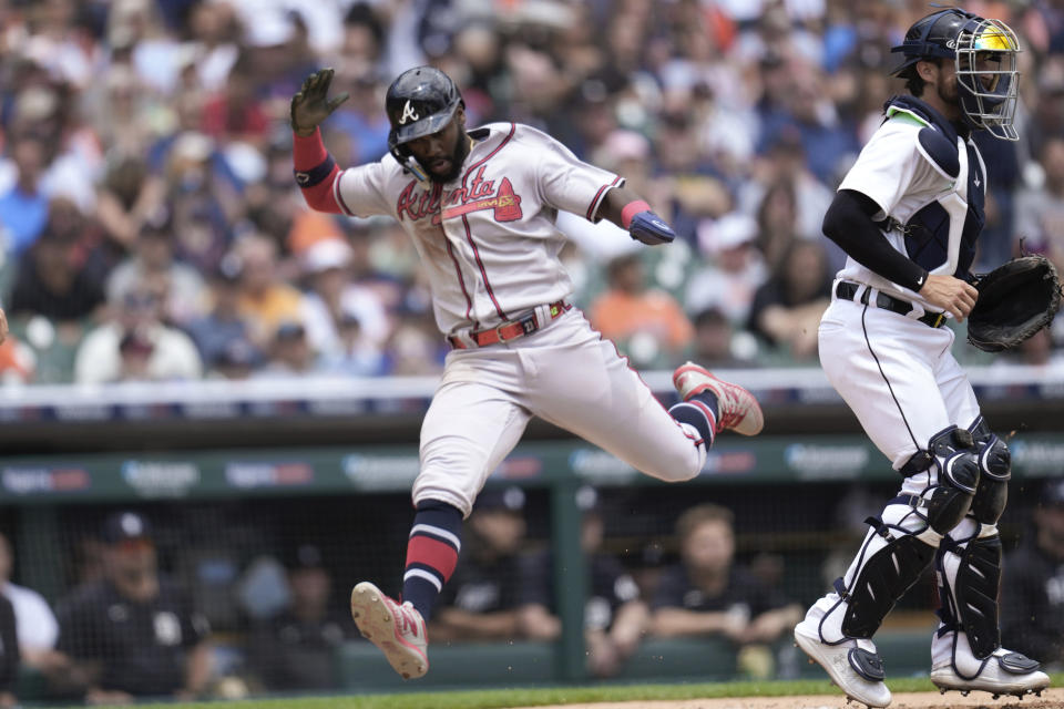 Atlanta Braves' Michael Harris II scores on a Ronald Acuna Jr. single against the Detroit Tigers in the fourth inning during the first baseball game of a doubleheader, Wednesday, June 14, 2023, in Detroit. (AP Photo/Paul Sancya)