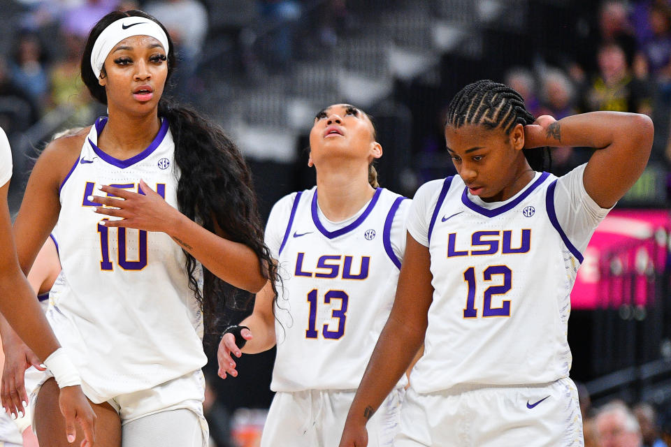 LSU forward Angel Reese, guard Last-Tear Poa and guard Mikaylah Williams look on during their women's college basketball game against Colorado on Nov. 6, 2023 at T-Mobile Arena in Las Vegas. (Photo by Brian Rothmuller/Icon Sportswire via Getty Images)