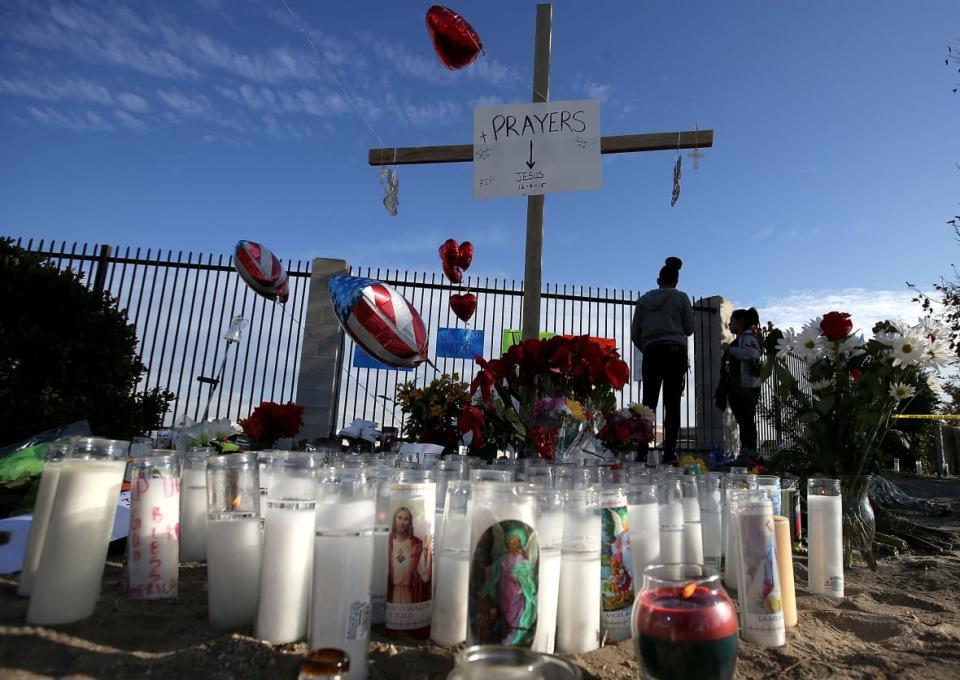 SAN BERNARDINO, CA – DECEMBER 04: People visit a makeshift memorial near the Inland Regional Center on December 4, 2015 in San Bernardino, California. The FBI has officially labeled the attack carried out by Syed Farook and his wife Tashfeen Malik as an act of terrorism. The San Bernardino community continues to mourn the attack at the Inland Regional Center in San Bernardino that left at least 14 people dead and another 21 injured. (Photo by Justin Sullivan/Getty Images)