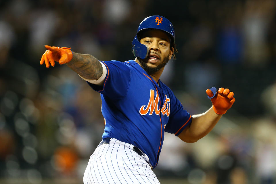 NEW YORK, NEW YORK - SEPTEMBER 29:  Dominic Smith #22 of the New York Mets celebrates after hitting a walk-off 3-run home run in the bottom of the eleventh inning against the Atlanta Braves at Citi Field on September 29, 2019 in New York City. (Photo by Mike Stobe/Getty Images)