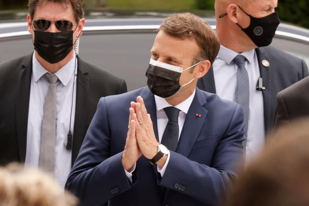 The French president, Emmanuel Macron, casts his vote at a polling station in Le Touquet on Sunday in the first round of the French regional elections (AFP via Getty Images)