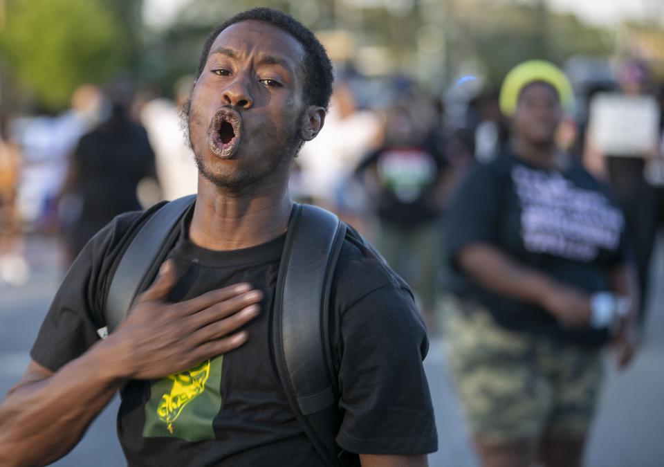 FILE - In this April 28, 2021 file photo, Dakwon Gibbs chants during a demonstration in Elizabeth City, N.C. The fatal shooting of a Black man by sheriff’s deputies has sent shock waves through Elizabeth City. The majority Black city in the state’s rural northeastern corner holds an important place in African American history in the 19th and 20th centuries. But some residents say it seemed too close-knit and too out-of-the-way to become a flashpoint in the 21st. (Robert Willett/The News & Observer via AP)