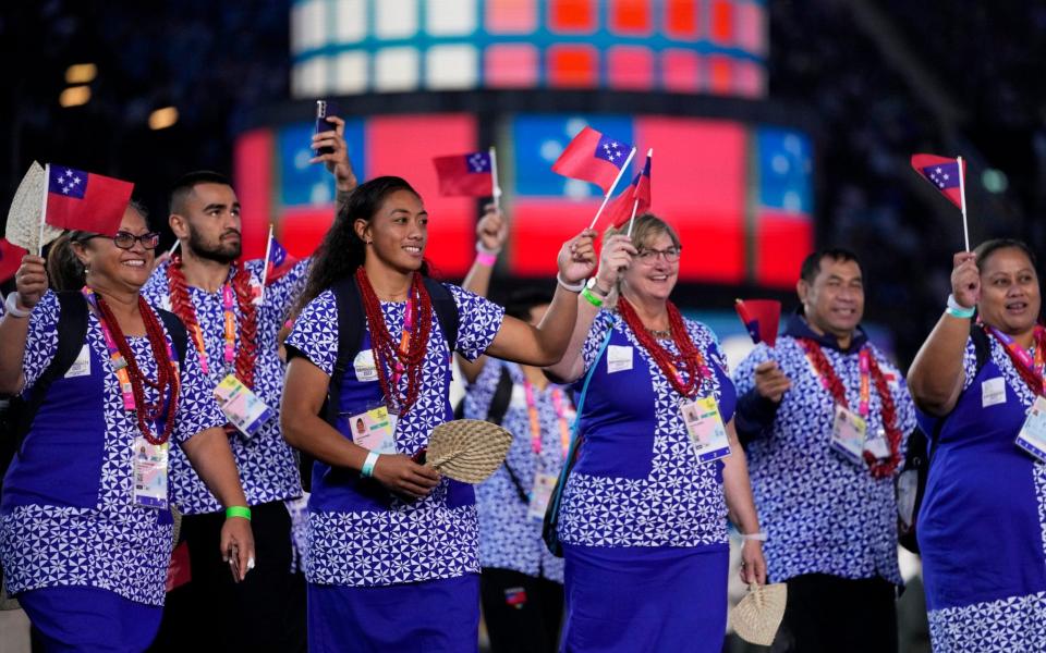 The athletes of Samoa enter the stadium during the Commonwealth Games opening ceremony  - AP