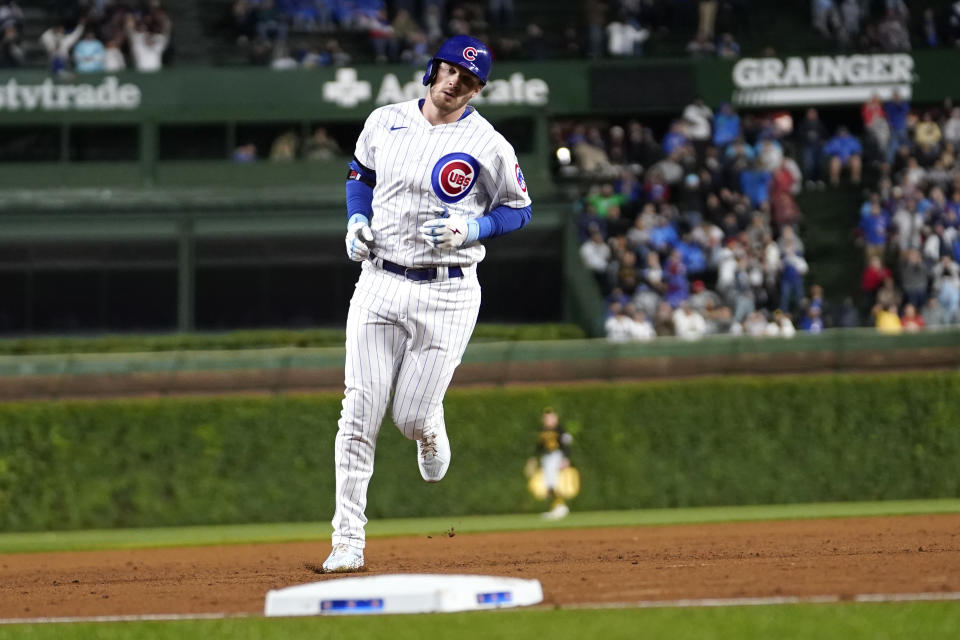 Chicago Cubs' Ian Happ runs the bases after his three-run home run off Pittsburgh Pirates starting pitcher Luis Ortiz during the first inning of a baseball game Tuesday, June 13, 2023, in Chicago. (AP Photo/Charles Rex Arbogast)