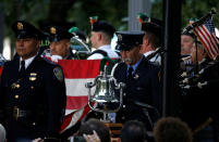 <p>Officers stand in silence at the National September 11 Memorial and Museum during ceremonies marking the 16th anniversary of the Sept. 11, 2001, attacks in New York, Sept. 11, 2017. (Photo: Brendan McDermid/Reuters) </p>