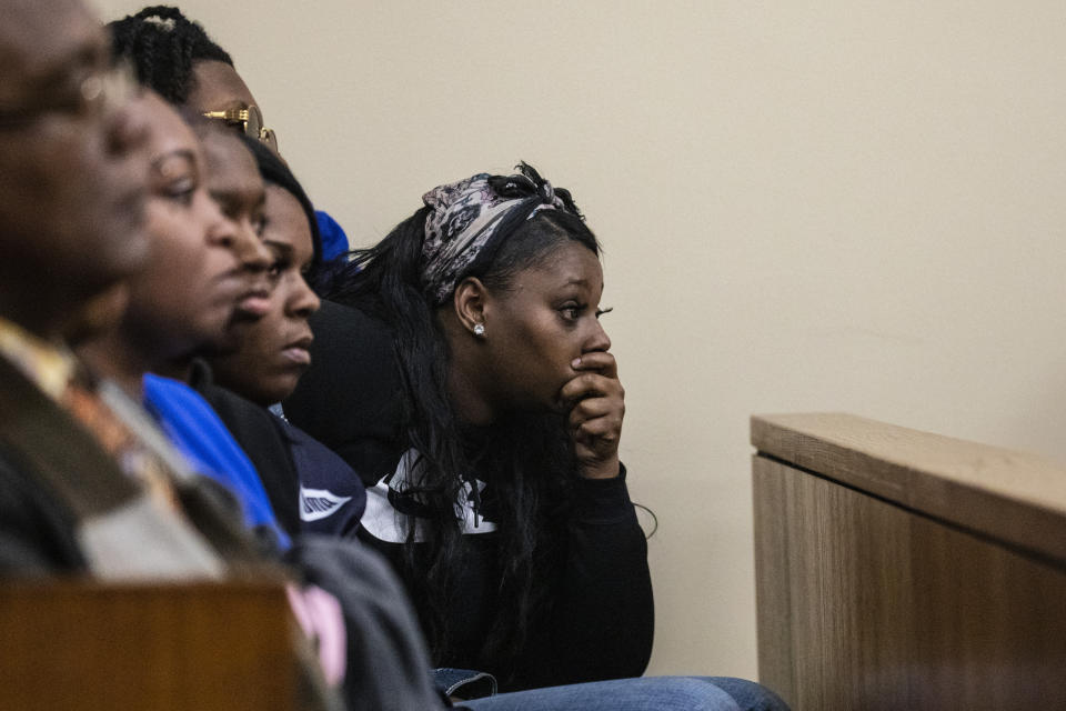 A member of the victim's family listens during a preliminary exam for co-defendants Jeremy Cuellar, 24, and Kemia Hassel, 22, at the Berrien County Courthouse in St. Joseph, Michigan on Wednesday, Feb. 20, 2019. They are charged with first-degree premeditated murder with the shooting death of U.S. Army Sgt. Tyrone Hassel III, 23, who was killed on Dec. 31, 2018. A police investigation revealed the pair, Cuellar and Hassel were having an affair and plotted to killed Tyrone to continue their relationship and reap financial benefits resulting from his death. Cuellar was stationed at Fort Stewart in Georgia where Kemia and Tyrone were also stationed, where they lived with their 1-year-old child. (Joel Bissell/Kalamazoo Gazette via AP)