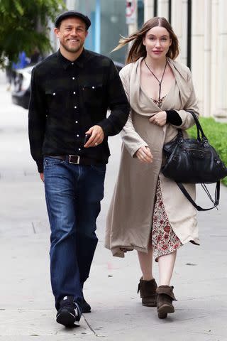 Backgrid Charlie Hunnam and girlfriend Morgana McNelis shop on Melrose together for furniture in June 2016 in Hollywood