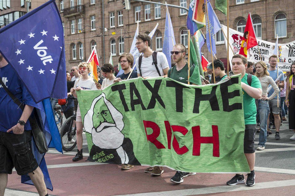 Demonstrators participate on a May Day march, in Nuremberg, Germany, May 1, 2024. (Daniel Vogl/dpa via AP)