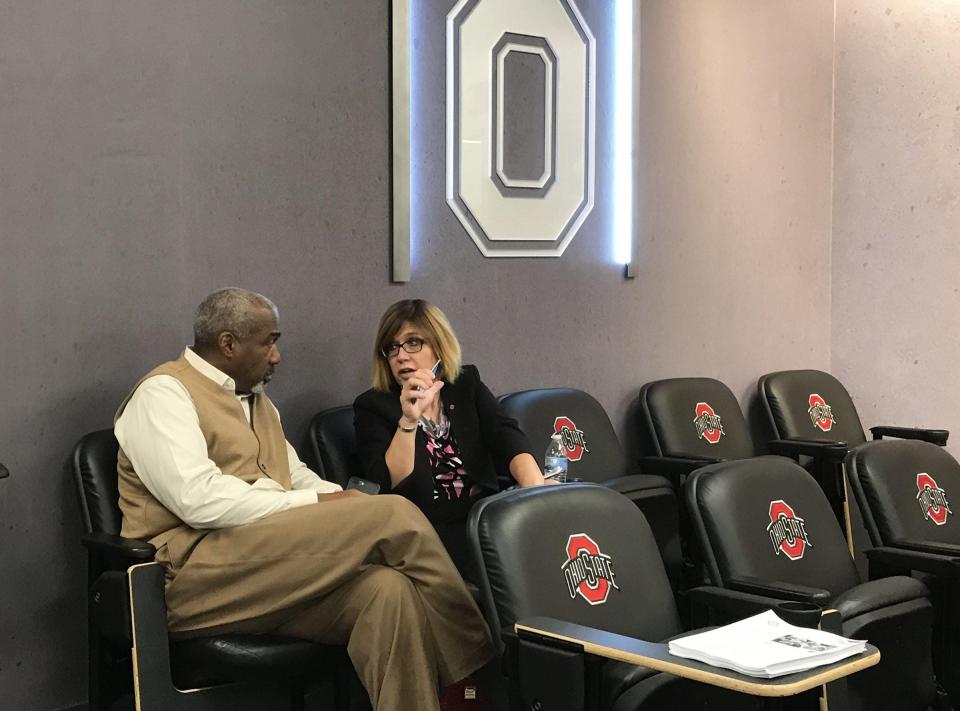 Ohio State athletic director Gene Smith, left, talks with Diana Sabau, Ohio State's senior associate athletics director and football administrator, at a 2017 news conference. Sabau might follow the path of other assistants under Smith who have landed athletic director positions at a Power Five conference school.