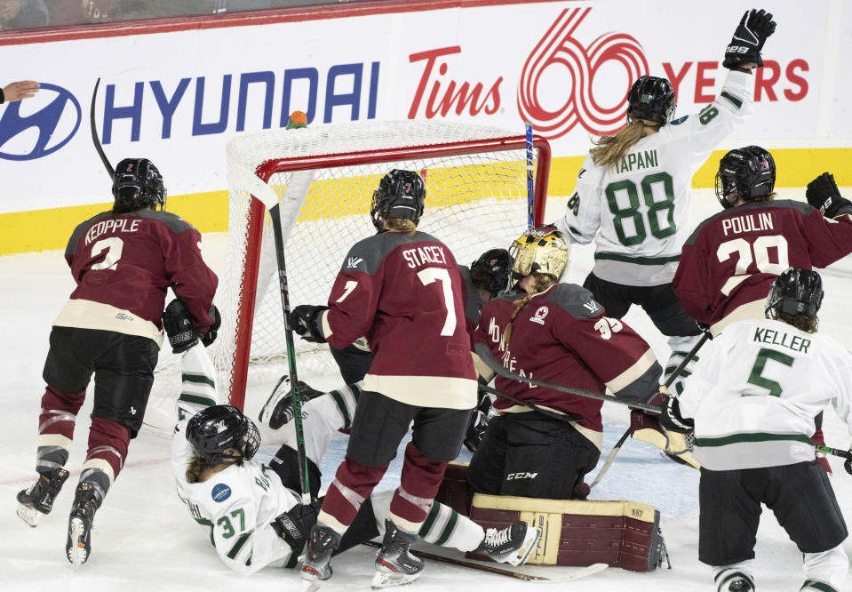 Boston's Susanna Tapani (88) celebrates her goal against Montreal goaltender Ann-Renee Desbiens (35) during overtime in Game 1 of a PWHL hockey playoff series Thursday, May 9, 2024, in Montreal. (Christinne Muschi/The Canadian Press via AP)