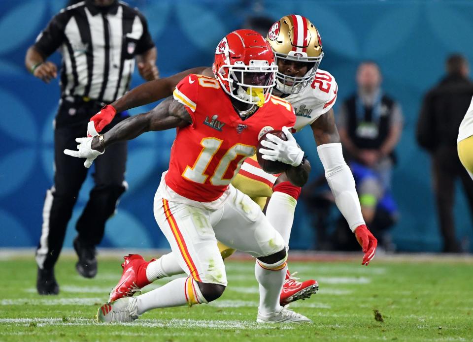San Francisco 49ers free safety Jimmie Ward looks to tackle Kansas City Chiefs wide receiver Tyreek Hill during the second quarter in Super Bowl LIV at Hard Rock Stadium.