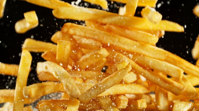 pile of fries being tossed