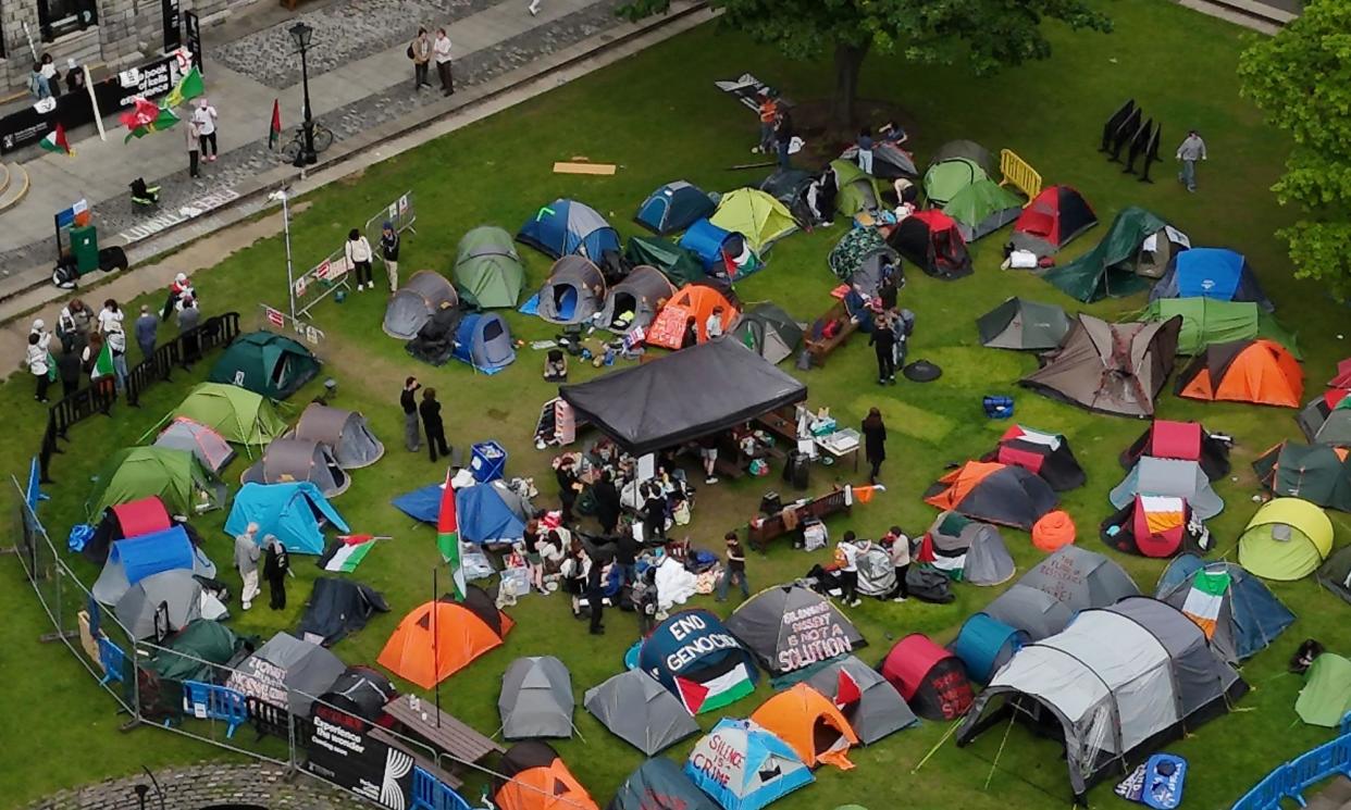 <span>The encampment protest in the grounds of Trinity College Dublin on Wednesday 8 May. The public were unable to visit the Book of Kells while it was going on, costing the college an estimated £300,000.</span><span>Photograph: Niall Carson/PA</span>
