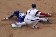 Chicago White Sox second baseman Nick Madrigal, right, tags out Kansas City Royals' Andrew Benintendi, left, at second during the eighth inning of a baseball game in Chicago, Sunday, April 11, 2021. (AP Photo/Nam Y. Huh)