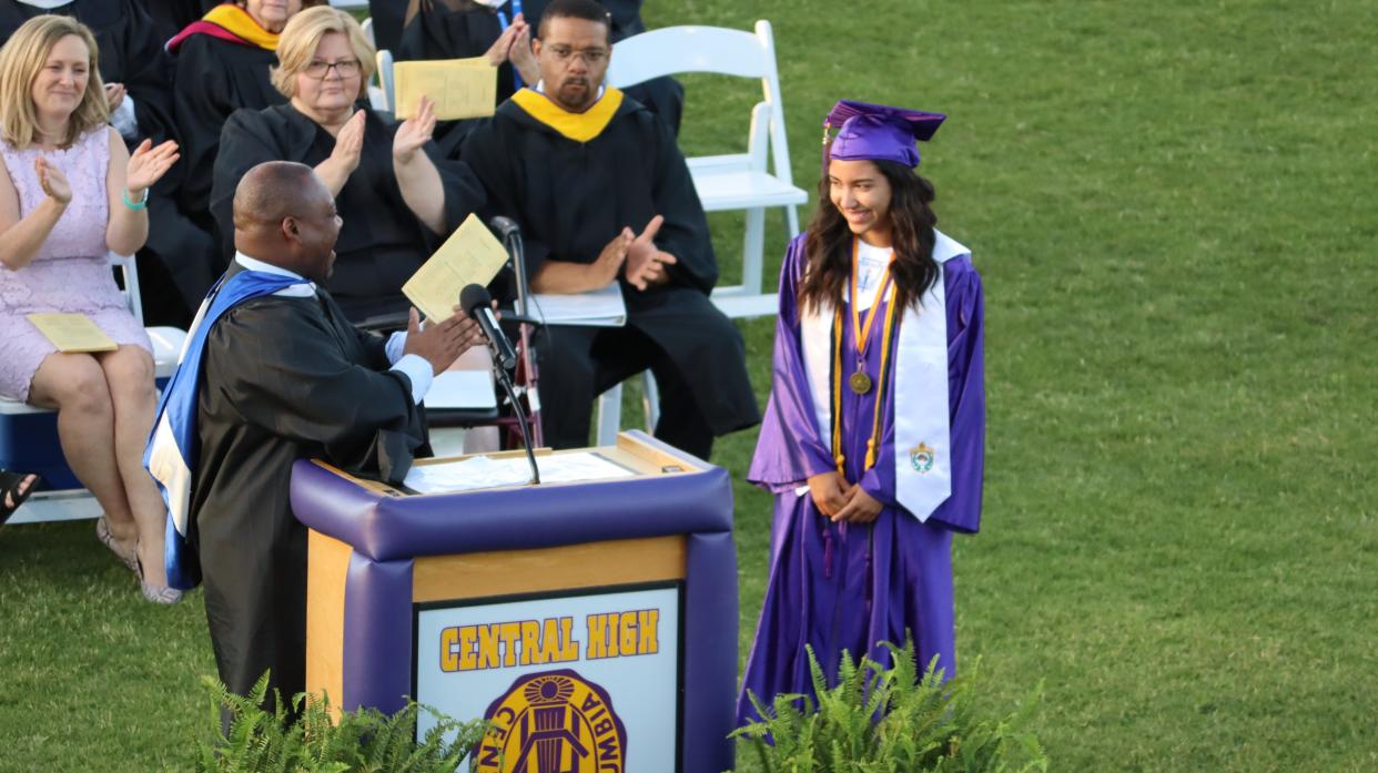Columbia Central High School Principal Kevin Eady surprises Sydney Castillo on graduation day with recognition for her accomplishment.