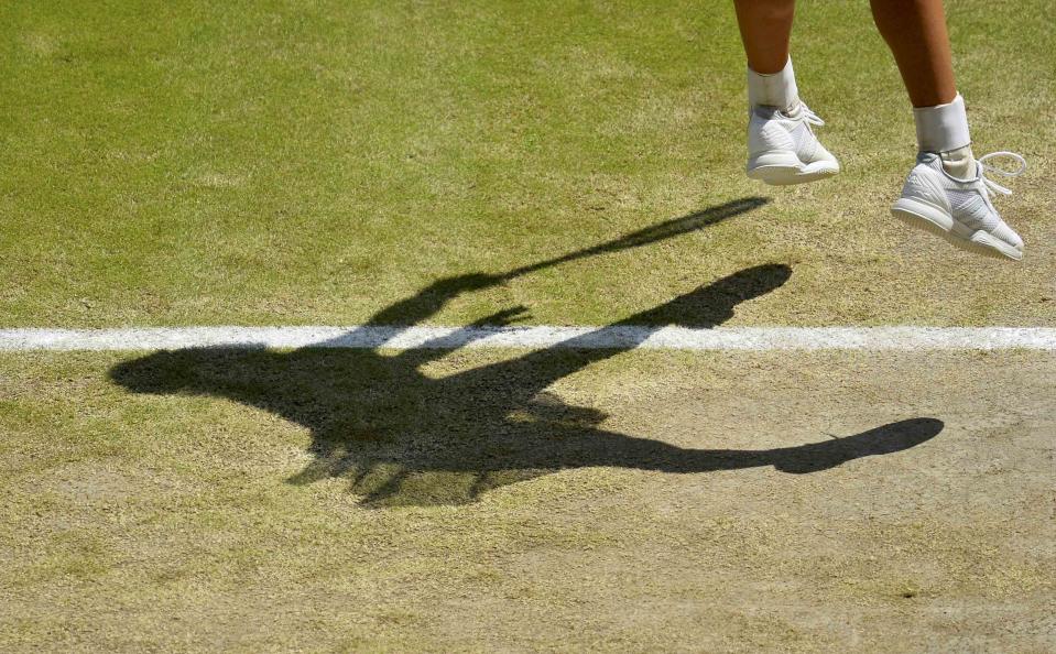 Garbine Muguruza of Spain serves during her match against Agnieszka Radwanska of Poland at the Wimbledon Tennis Championships in London, July 9, 2015. REUTERS/Glyn Kirk/Pool