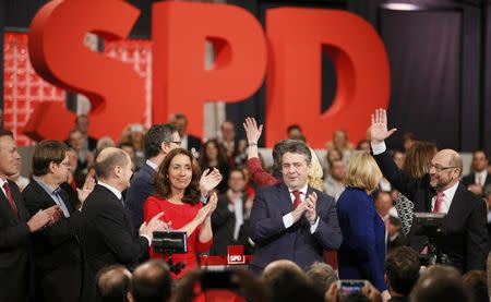 SPD leaders with outgoing Social Democratic Party (SPD) leader Sigmar Gabriel and incoming party leader and candidate in the upcoming general elections Martin Schulz open an SPD party convention in Berlin, Germany, March 19, 2017. REUTERS/Axel Schmidt