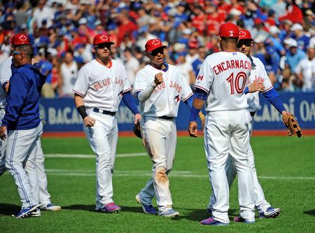 Aug 30, 2015; Toronto, Ontario, CAN; Toronto Blue Jays team celebrate win against Detroit Tigers at Rogers Centre. Mandatory Credit: Peter Llewellyn-USA TODAY Sports