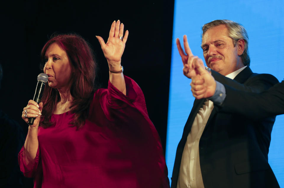 Peronist presidential candidate Alberto Fernández, right, and running mate, former President Cristina Fernández, address supporters after incumbent President Mauricio Macri conceded defeat at the end of election day in Buenos Aires, Argentina, Sunday, Oct. 27, 2019. (AP Photo/Natacha Pisarenko)