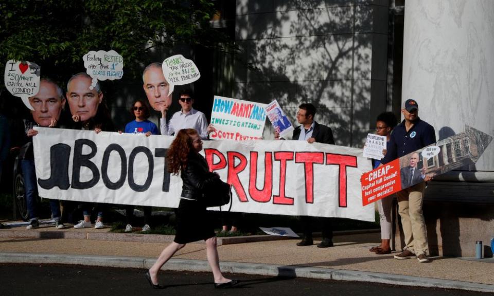 People protest Scott Pruitt in Washington DC on 26 April 2018.