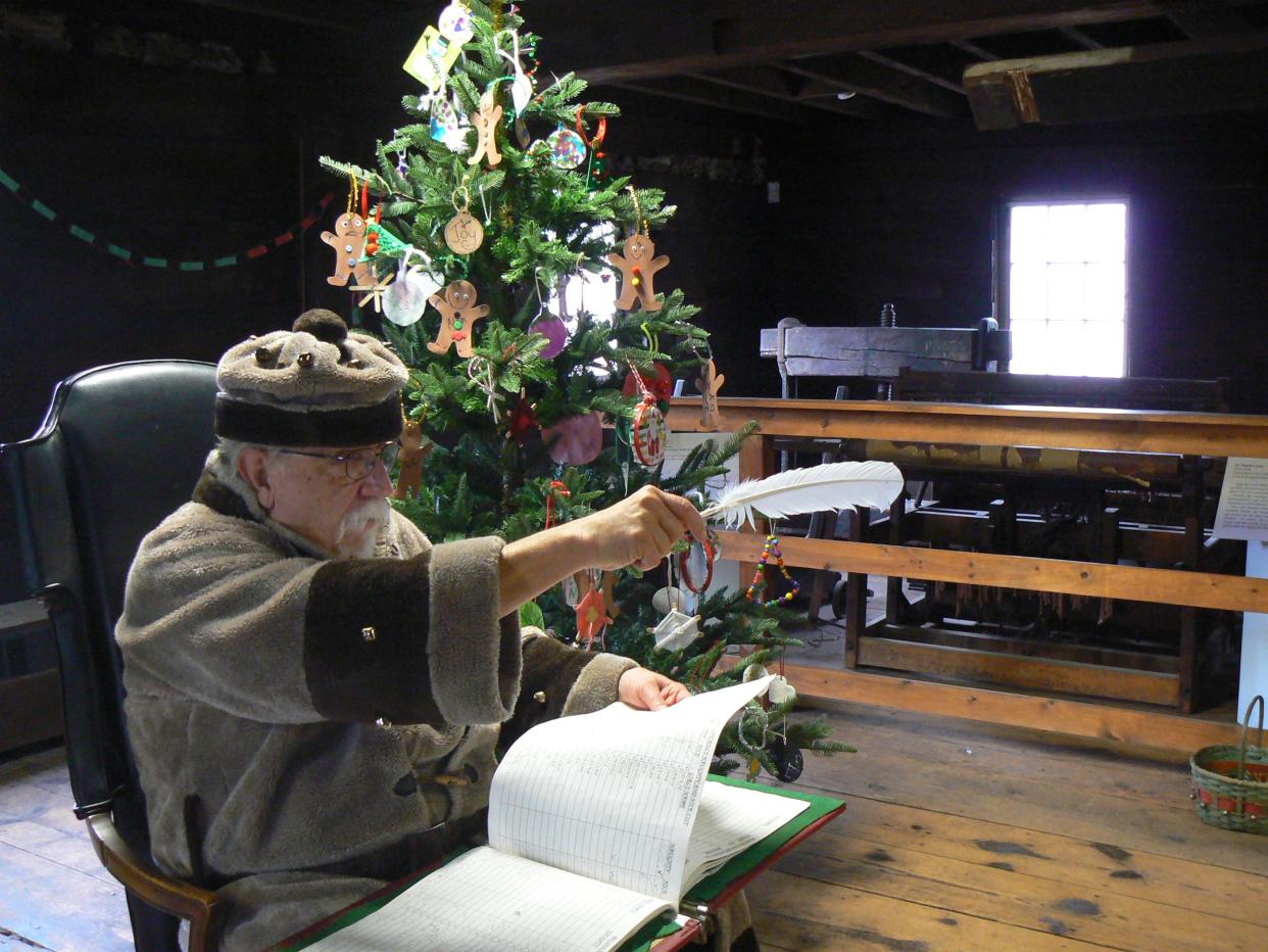 Belsnickel points out the nice with his special quill.