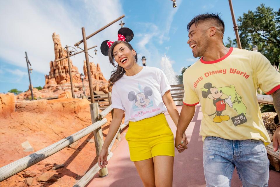 A couple holding hands in Walt Disney World