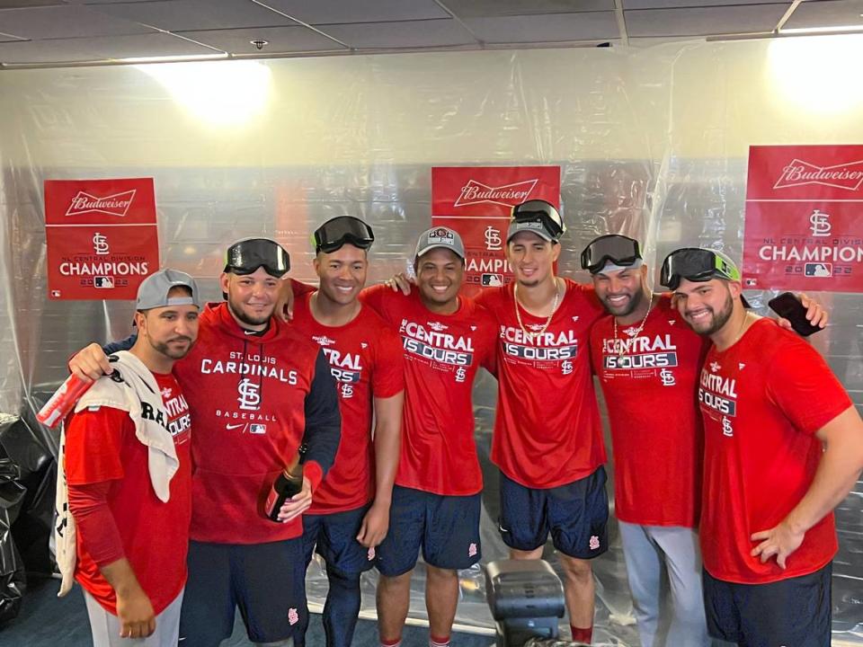 Members of the St. Louis Cardinals are all smiles following the team’s 6-2 victory against Milwaukee on Tuesday night. The win secured the organization’s 12th Central Division crown.