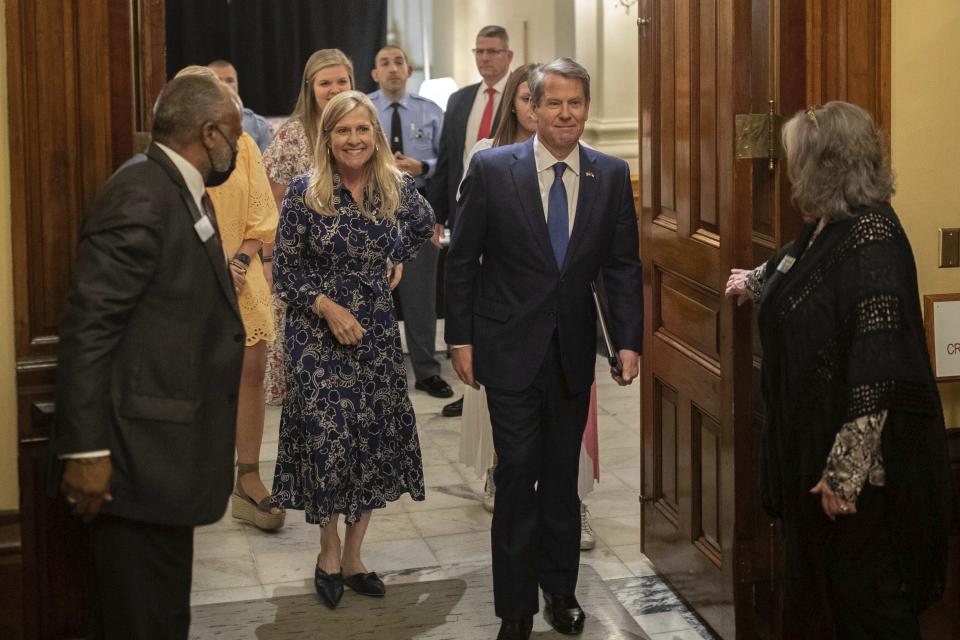 Gov. Brian Kemp enters the House Chamber on Sine Die, the last day of the General Assembly at the Georgia State Capitol in Atlanta on Monday, April 4, 2022. (Branden Camp/Atlanta Journal-Constitution via AP)