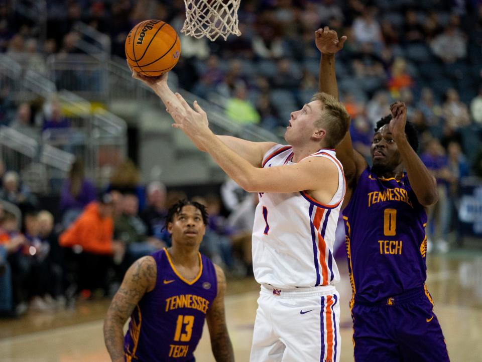 Tanner Cuff (1) of Evansville takes a shot as the University of Evansville Purple Aces play the Tennessee Tech Golden Eagles at the Ford Center in Evansville, Indiana, Wednesday, December 20, 2023. Evansville won 82-51.