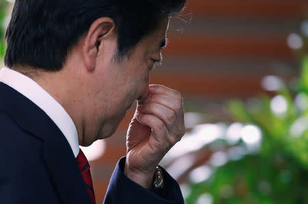 Japan's Prime Minister Shinzo Abe walks after speaking on reports of the launch of a North Korean missile to reporters , at his official residence in Tokyo, Japan May 29, 2017. REUTERS/Toru Hanai