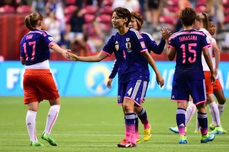 Jun 8, 2015; Vancouver, British Columbia, CAN; Japan defender Saki Kumagai (4) celebrates with Japan forward Yuki Ogimi (17) after defeating Switzerland 1-0 in a Group C soccer match in the 2015 women's World Cup at BC Place Stadium. Mandatory Credit: Anne-Marie Sorvin-USA TODAY Sports