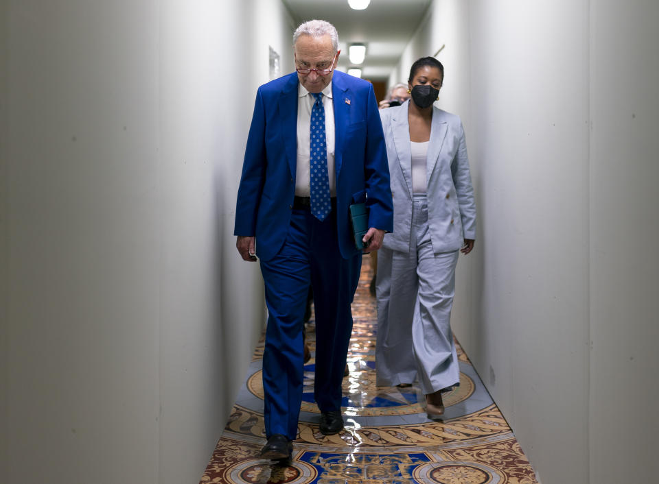 Senate Majority Leader Chuck Schumer, D-N.Y., crosses through a construction tunnel at the Capitol in Washington, Wednesday, June 22, 2022. After Senate bargainers reached agreement on a bipartisan gun violence bill, Schumer predicted Senate approval later this week, and passage by the Democratic-led House could follow quickly. (AP Photo/J. Scott Applewhite)